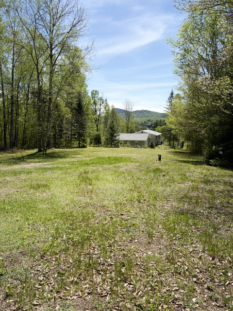 This vacation property includes a large lawn and is ideal for families.