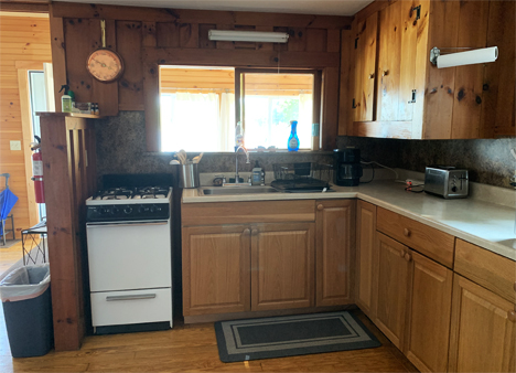 This casual setting also includes a living space decorated and furnished in country decor.