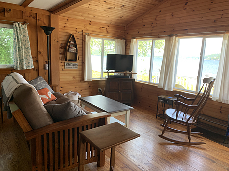 Enjoy water views from this cozy living room.